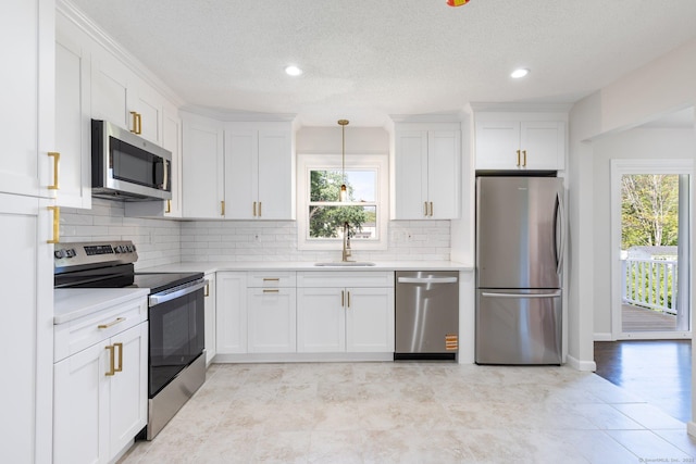 447 Palisado Ave, Windsor, CT 06095 - kitchen with appliances with stainless steel finishes, light countertops, plenty of natural light, recessed lighting, and a textured ceiling