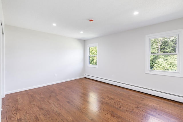 447 Palisado Ave, Windsor, CT 06095 - empty room featuring a baseboard radiator, wood finished floors, recessed lighting, and baseboards