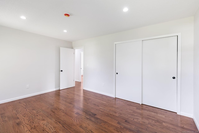 447 Palisado Ave, Windsor, CT 06095 - unfurnished bedroom featuring wood finished floors, recessed lighting, baseboards, and a closet