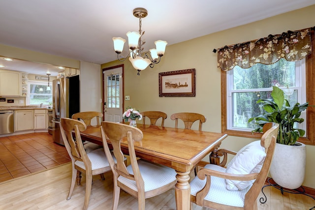 8 Whippoorwill Ln, Bethany, CT 06524 - dining room with a chandelier and light wood-type flooring