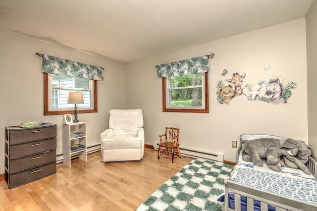 8 Whippoorwill Ln, Bethany, CT 06524 - bedroom with multiple windows, light wood-type flooring, and a baseboard radiator