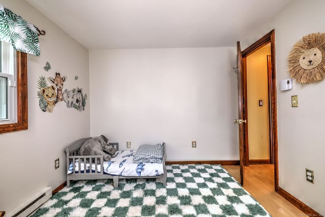 8 Whippoorwill Ln, Bethany, CT 06524 - bedroom featuring baseboard heating, wood finished floors, and baseboards