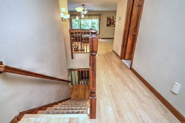 8 Whippoorwill Ln, Bethany, CT 06524 - staircase with hardwood / wood-style floors, a chandelier, baseboards, and a ceiling fan