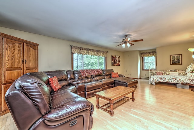 8 Whippoorwill Ln, Bethany, CT 06524 - living area featuring light wood-style flooring, a ceiling fan, and a baseboard radiator