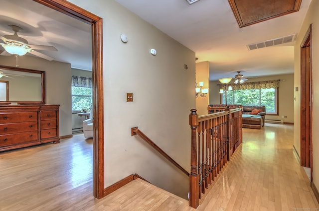 8 Whippoorwill Ln, Bethany, CT 06524 - hall featuring an upstairs landing, light wood finished floors, a baseboard heating unit, and attic access