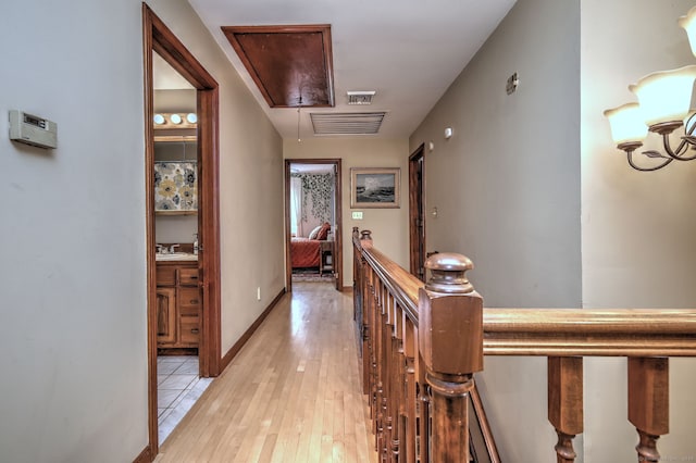 8 Whippoorwill Ln, Bethany, CT 06524 - hall featuring attic access, an upstairs landing, light wood-type flooring, and a sink