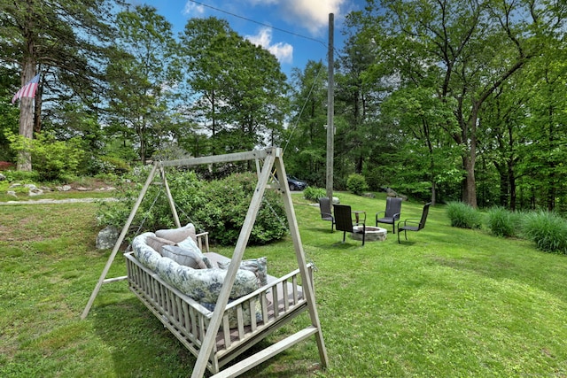 8 Whippoorwill Ln, Bethany, CT 06524 - view of grassy yard featuring an outdoor fire pit and view of wooded area