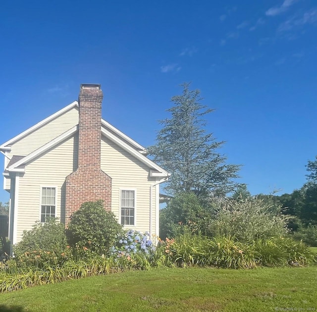 41 Mesa Dr, Bethany, CT 06524 - view of side of home featuring a chimney