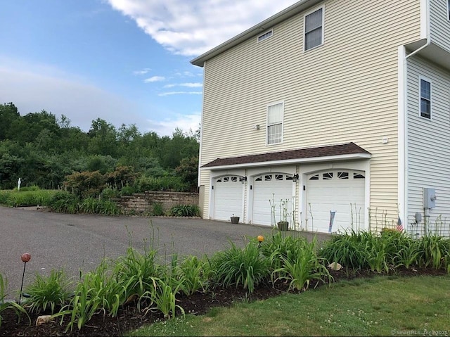 41 Mesa Dr, Bethany, CT 06524 - view of property exterior with a garage and asphalt driveway