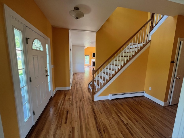 41 Mesa Dr, Bethany, CT 06524 - entrance foyer featuring baseboard heating, baseboards, wood finished floors, and stairway