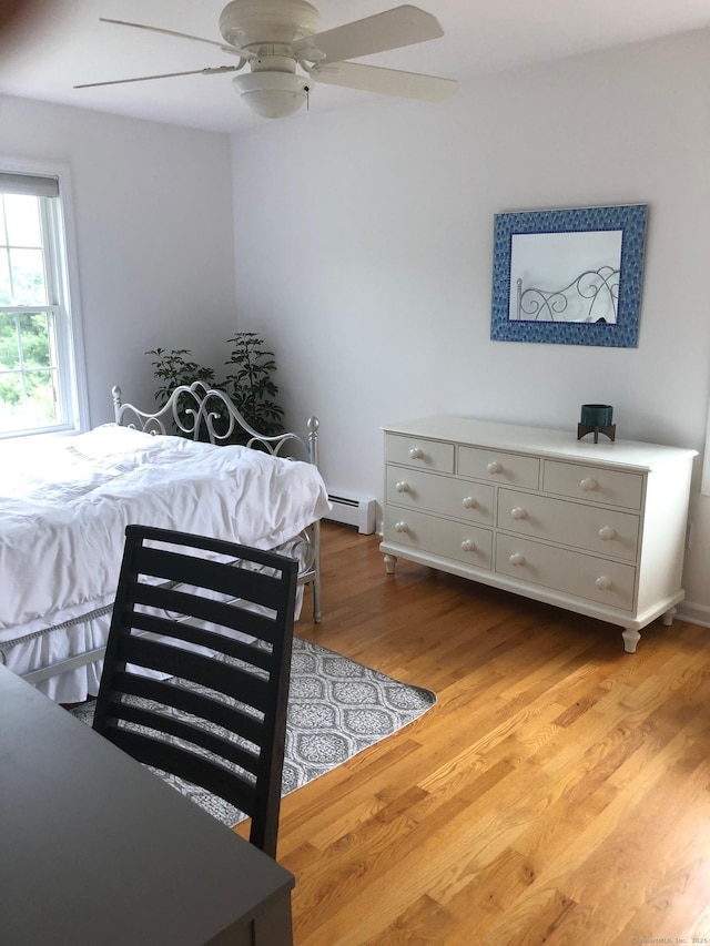 41 Mesa Dr, Bethany, CT 06524 - bedroom with a baseboard radiator, wood finished floors, and a ceiling fan