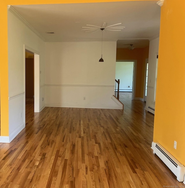 41 Mesa Dr, Bethany, CT 06524 - spare room with a baseboard radiator, ornamental molding, wood finished floors, a baseboard heating unit, and ceiling fan
