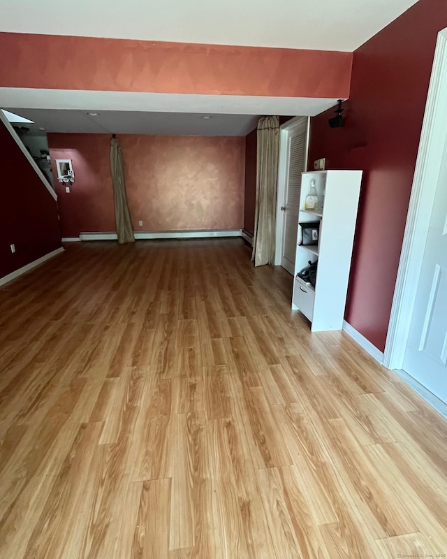 41 Mesa Dr, Bethany, CT 06524 - unfurnished room with light wood finished floors, baseboards, and a baseboard heating unit