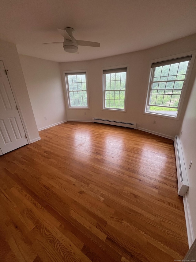 41 Mesa Dr, Bethany, CT 06524 - empty room featuring a baseboard radiator, wood finished floors, and ceiling fan