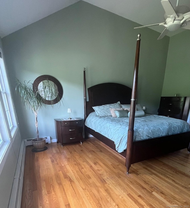 41 Mesa Dr, Bethany, CT 06524 - bedroom with light wood finished floors, vaulted ceiling, a baseboard heating unit, a ceiling fan, and baseboard heating