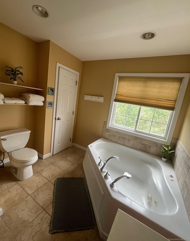 41 Mesa Dr, Bethany, CT 06524 - full bath featuring a whirlpool tub, toilet, tile patterned flooring, and baseboards