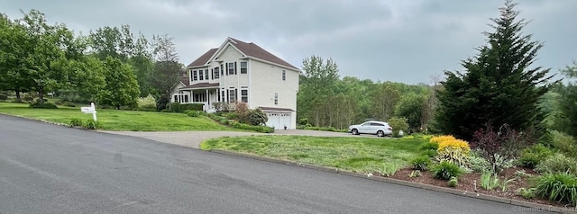 41 Mesa Dr, Bethany, CT 06524 - view of home's exterior featuring an attached garage, a lawn, and driveway