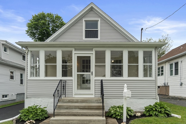 128 Grove Pl, West Haven, CT 06516 - bungalow-style home with a sunroom and entry steps