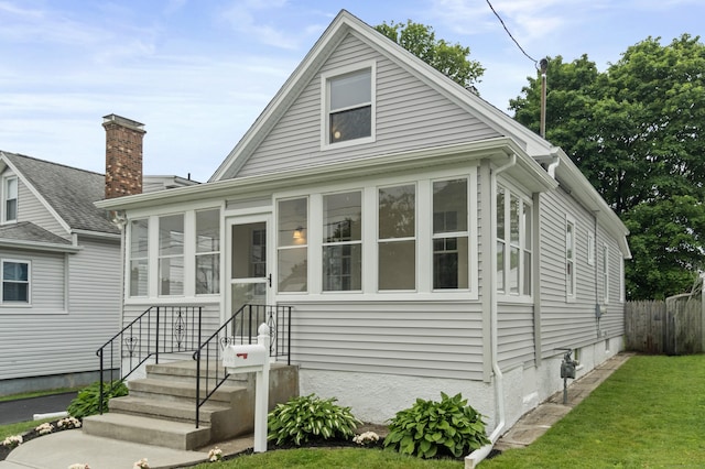 128 Grove Pl, West Haven, CT 06516 - bungalow-style home with a sunroom