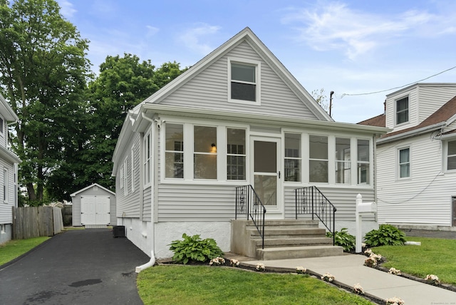 128 Grove Pl, West Haven, CT 06516 - bungalow-style home with a sunroom