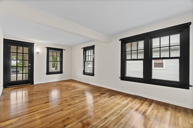 128 Grove Pl, West Haven, CT 06516 - empty room featuring hardwood / wood-style flooring, baseboards, and beamed ceiling