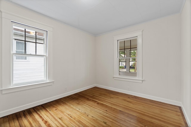 128 Grove Pl, West Haven, CT 06516 - unfurnished room with light wood finished floors, baseboards, and crown molding