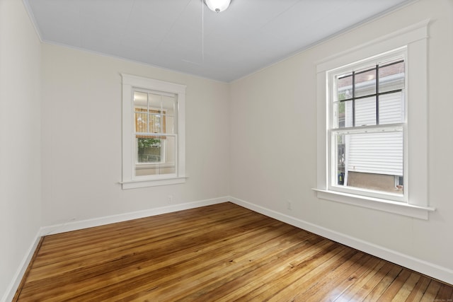 128 Grove Pl, West Haven, CT 06516 - spare room with light wood-style floors, crown molding, and baseboards