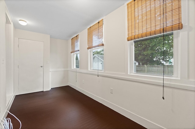 128 Grove Pl, West Haven, CT 06516 - unfurnished room with dark wood-style floors, plenty of natural light, and baseboards