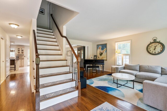 220 Bushy Hill Rd, Deep River, CT 06417 - living room featuring wood finished floors, stairway, and baseboards