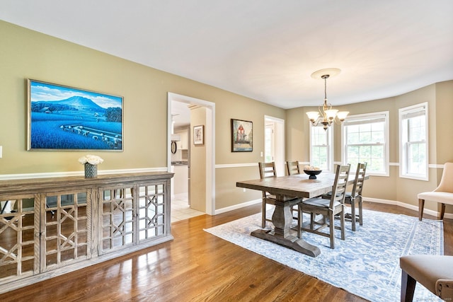 220 Bushy Hill Rd, Deep River, CT 06417 - dining room with a chandelier, wood finished floors, and baseboards