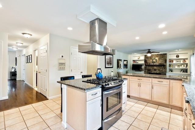 220 Bushy Hill Rd, Deep River, CT 06417 - kitchen with island range hood, stainless steel gas range oven, a ceiling fan, light tile patterned flooring, and open floor plan
