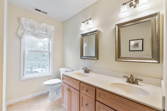 220 Bushy Hill Rd, Deep River, CT 06417 - bathroom featuring toilet, double vanity, baseboards, and tile patterned floors