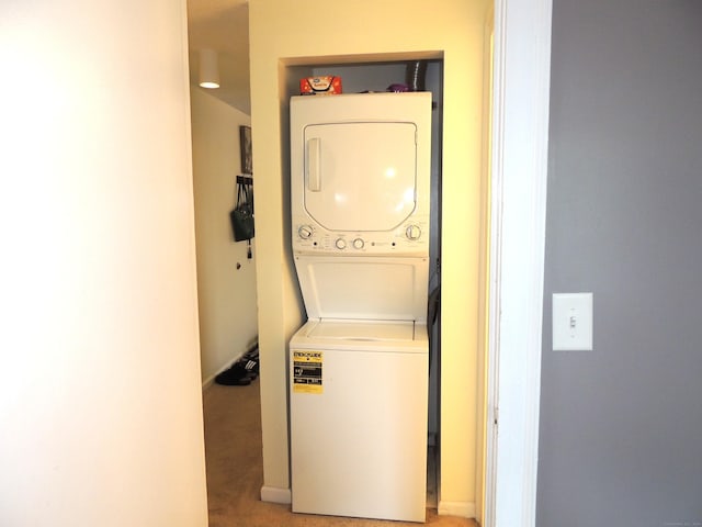16 Essex St Unit 5F, Hartford, CT 06114 - washroom with stacked washer / dryer and light colored carpet