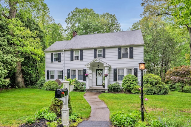 1 Stevens Rd, Middlebury, CT 06762 - colonial-style house featuring a chimney and a front yard
