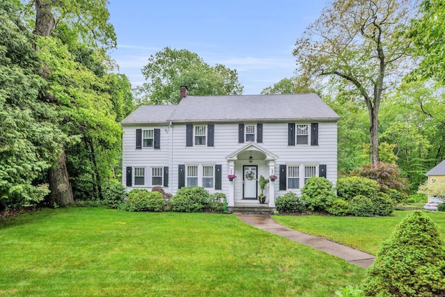 1 Stevens Rd, Middlebury, CT 06762 - colonial-style house with a chimney and a front lawn