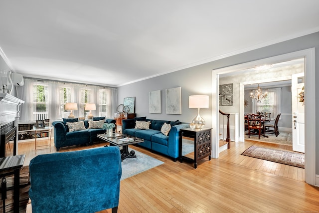 1 Stevens Rd, Middlebury, CT 06762 - living area with a chandelier, crown molding, wood-type flooring, a high end fireplace, and baseboards