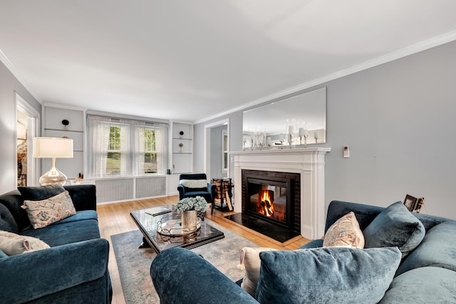 1 Stevens Rd, Middlebury, CT 06762 - living area with crown molding, a fireplace, wood finished floors, and built in features