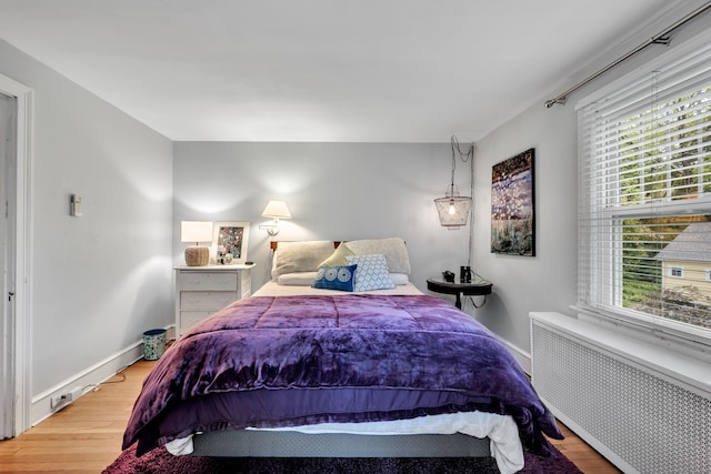 1 Stevens Rd, Middlebury, CT 06762 - bedroom featuring radiator heating unit, light wood finished floors, and baseboards