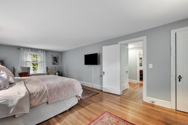 1 Stevens Rd, Middlebury, CT 06762 - bedroom with light wood finished floors and baseboards