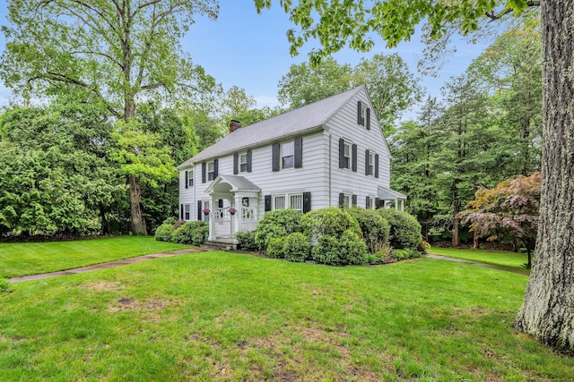 1 Stevens Rd, Middlebury, CT 06762 - colonial home with a chimney and a front lawn