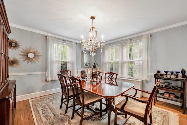 1 Stevens Rd, Middlebury, CT 06762 - dining space featuring a chandelier, crown molding, wood finished floors, and baseboards