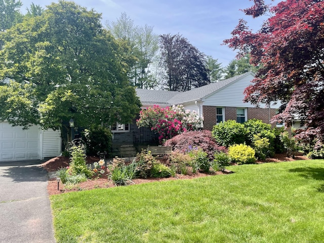 35 W Ridge Dr, West Hartford, CT 06117 - view of front of property featuring a front yard, brick siding, and driveway