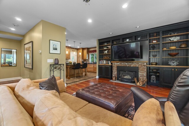 238 Park Rd, Oxford, CT 06478 - living area featuring wood finished floors, recessed lighting, baseboards, and a wood stove
