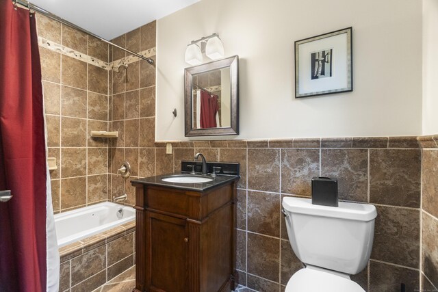238 Park Rd, Oxford, CT 06478 - full bath featuring tile walls, vanity, toilet, tiled shower / bath combo, and a wainscoted wall