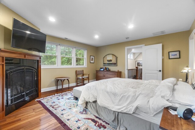 238 Park Rd, Oxford, CT 06478 - bedroom featuring light wood-style floors, a fireplace, baseboards, and recessed lighting