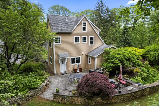 238 Park Rd, Oxford, CT 06478 - back of property with roof with shingles and a patio