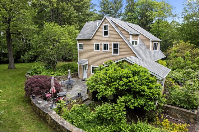 238 Park Rd, Oxford, CT 06478 - view of side of property featuring a patio, a lawn, and a shingled roof