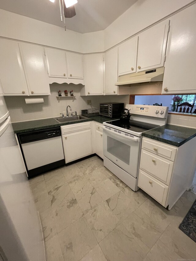 200 Woodmont Ave Apt 127, Bridgeport, CT 06606 - kitchen featuring under cabinet range hood, white appliances, a sink, light marble finish flooring, and white cabinets