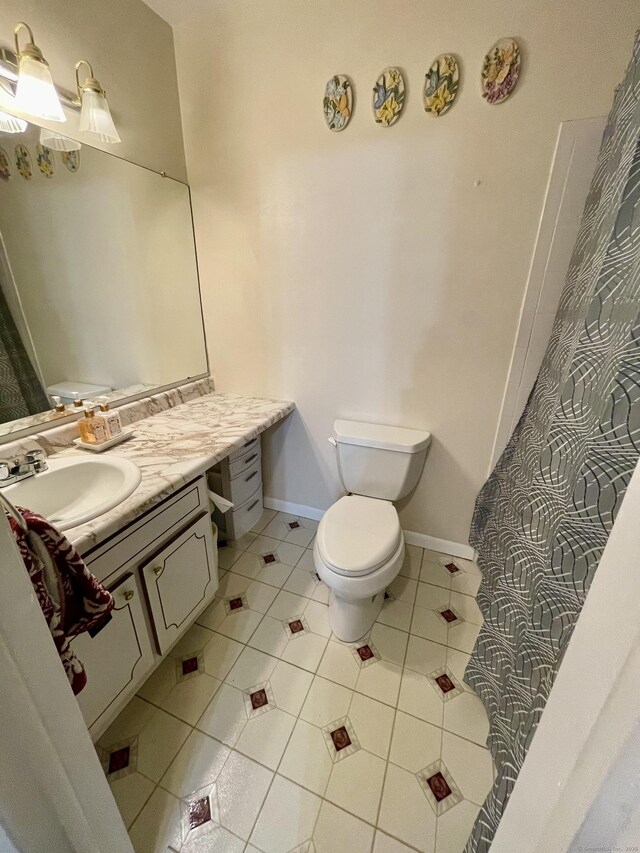 200 Woodmont Ave Apt 127, Bridgeport, CT 06606 - full bath with toilet, tile patterned floors, and vanity