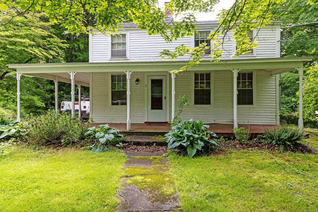 2 Depot Hill Rd, East Hampton, CT 06414 - view of front facade featuring covered porch and a front lawn